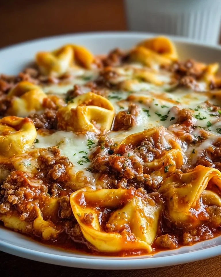 Delicious beefy tortellini bake served in a cozy dish, perfect for family meals.