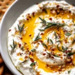 Delicious ricotta dip topped with hot honey served in a bowl