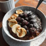 Delicious high-fibre chocolate oatmeal topped with fruits and nuts