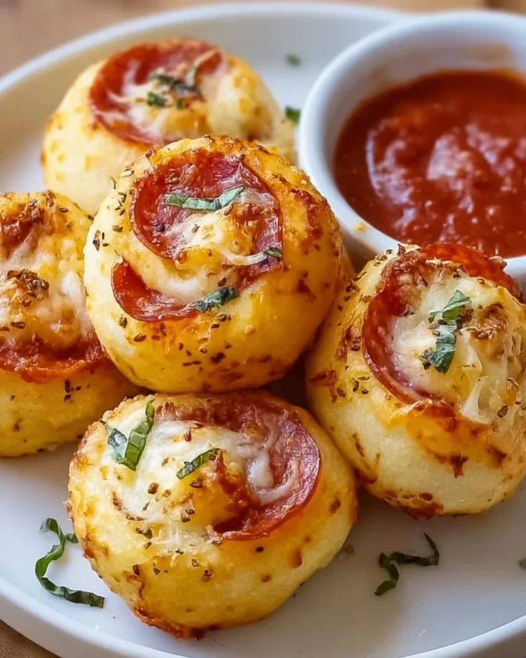 Plate of homemade pizza rolls, perfect for game day snacks and celebrations
