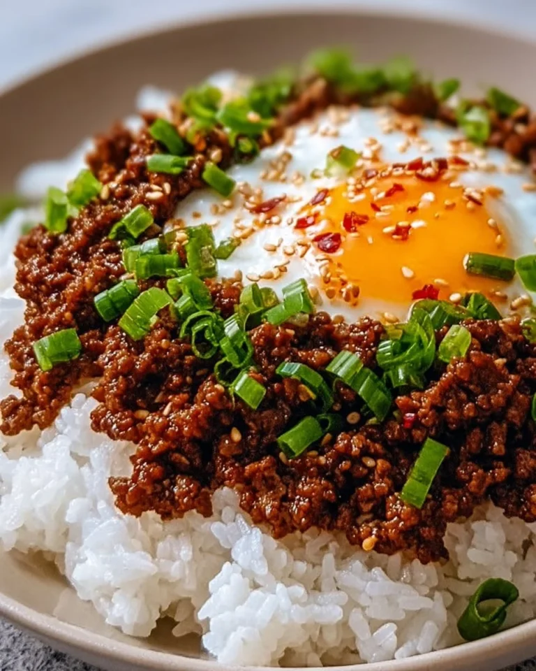 Delicious Spicy Korean Ground Beef Bowl garnished with green onions and sesame seeds.