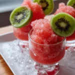 A vibrant watermelon kiwi granita served in a glass, showcasing its refreshing texture.