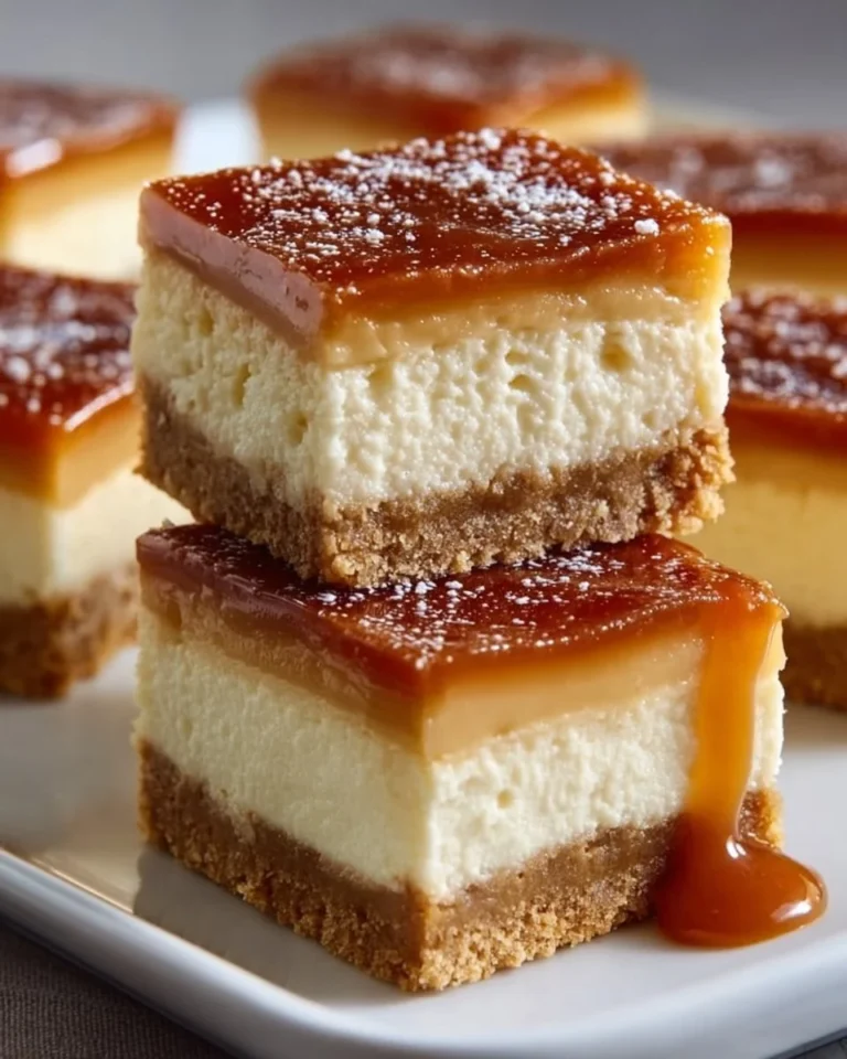 Delicious Dulce de Leche Cheesecake Bars garnished with caramel drizzle