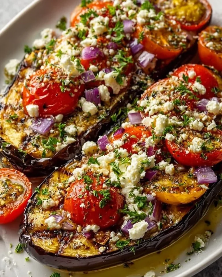 Greek Style Roasted Eggplant dish garnished with herbs and spices