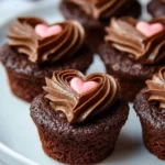 Heart-shaped chocolate cupcakes topped with rich frosting