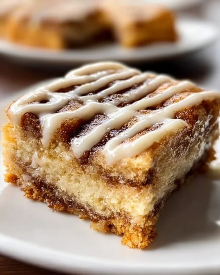 Delicious Cinnamon Roll Bliss Bars with creamy icing and swirls of cinnamon.