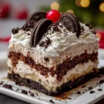 No-Bake Christmas Oreo Lasagna dessert with layers of creamy filling and crushed Oreos