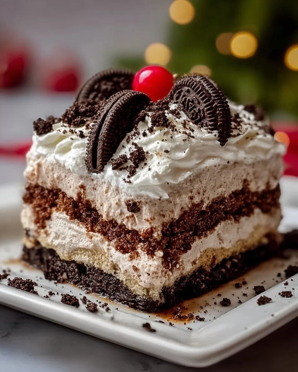 No-Bake Christmas Oreo Lasagna dessert with layers of creamy filling and crushed Oreos
