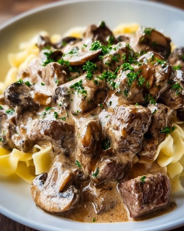 Delicious Beef Stroganoff served in a bowl with noodles and mushrooms