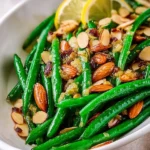 Classic green beans almondine with sautéed almonds and vibrant green beans