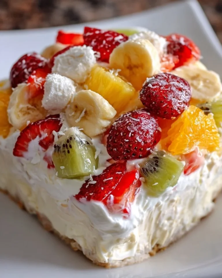 A bowl of Hawaiian Cheesecake Salad with tropical fruits and creamy cheesecake dressing.