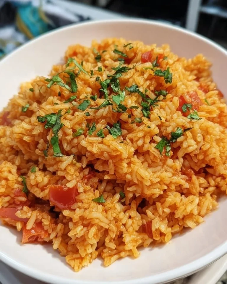 Delicious homemade Spanish rice served in a bowl with spices and herbs