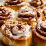 Fluffy one hour cinnamon rolls ready to be enjoyed fresh out of the oven.