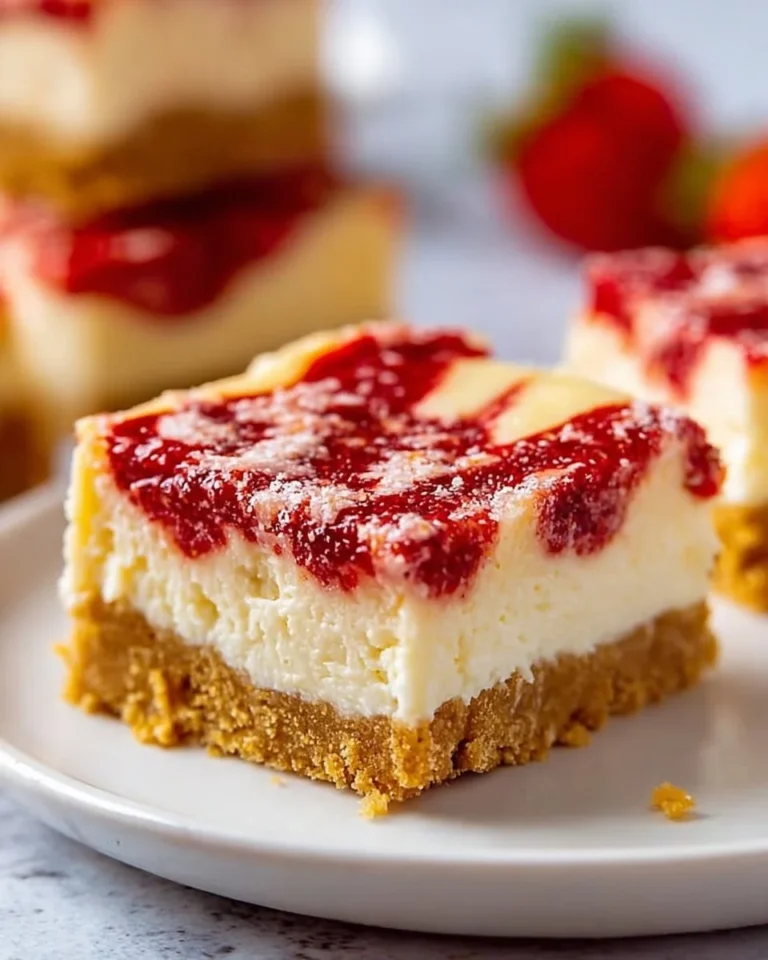 Delicious soft strawberry cheesecake bars styled on a plate