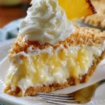 Delicious No-Bake Pineapple Cheesecake Pie topped with fresh pineapple slices.
