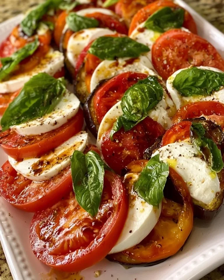 Delicious eggplant caprese salad with fresh mozzarella, basil, and tomatoes